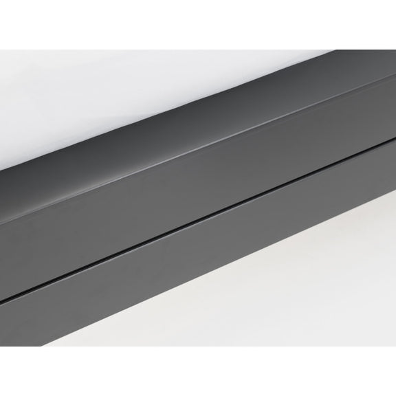 Close-up of a dark gray metal strip on a white background