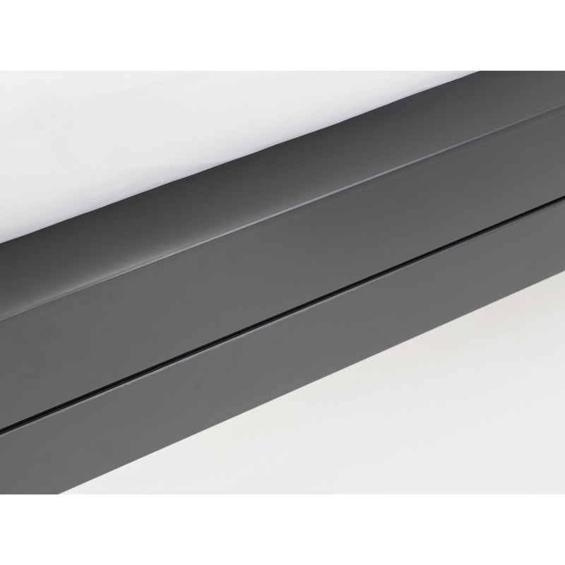 Close-up of a dark gray metal strip on a white background