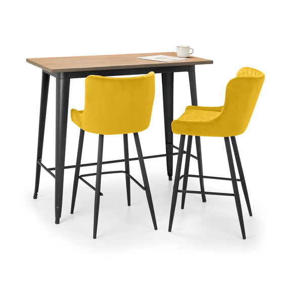 Two yellow bar stools in front of a wooden table on a white background