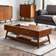 Wooden coffee table with books in a living room setting