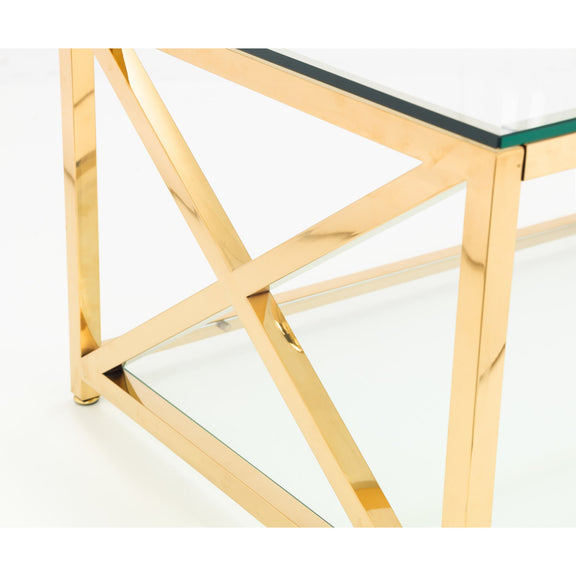 Gold geometric coffee table with a green glass top on a white background