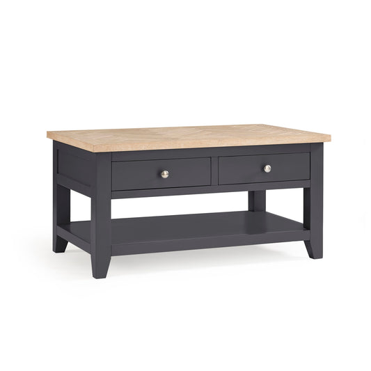 Wooden coffee table with dark gray base on a white background