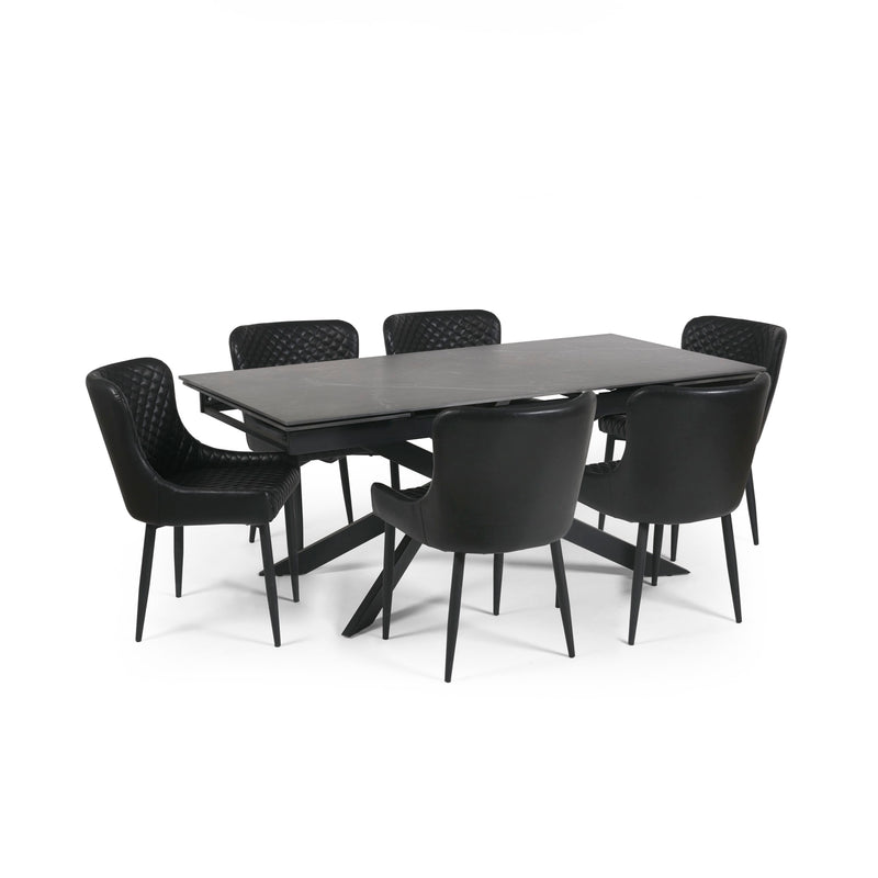 Black dining table with six chairs on a white background