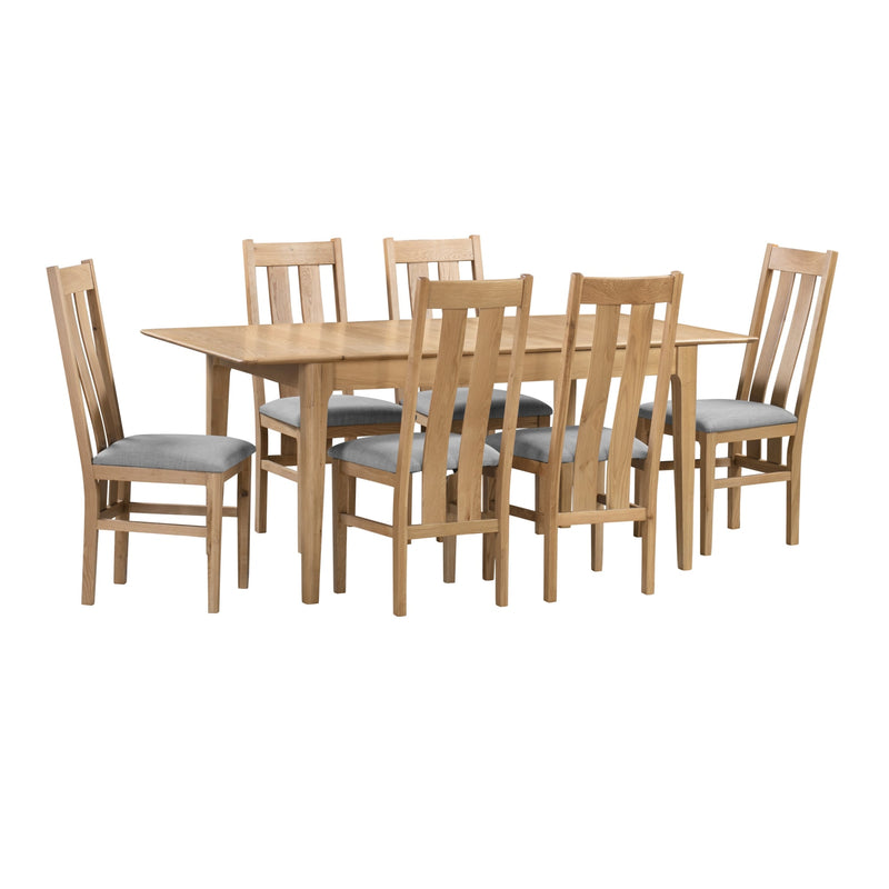Wooden dining table with six matching chairs on a white background