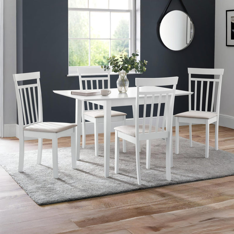 White dining set with table and chairs in a room with a window and mirror.