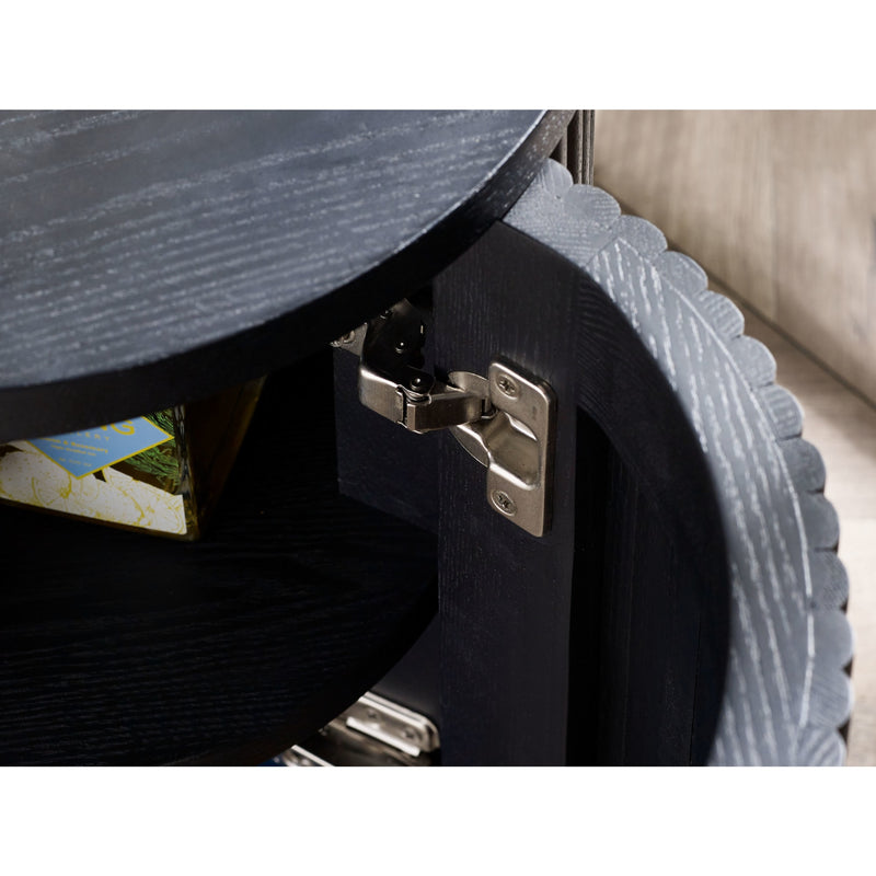 Close-up of a black suitcase with a textured surface and visible latches.