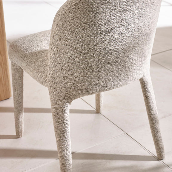 Close-up of a textured chair on a light wooden floor