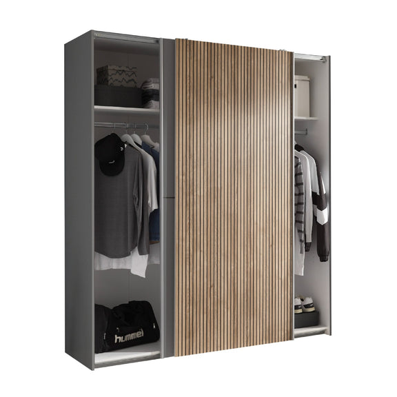 Modern wardrobe with wooden and gray panels, clothes hanging inside.