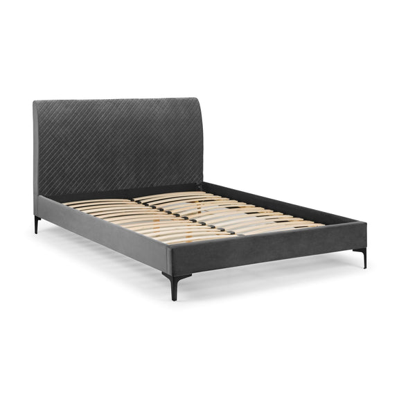 Gray upholstered bed frame on a white background