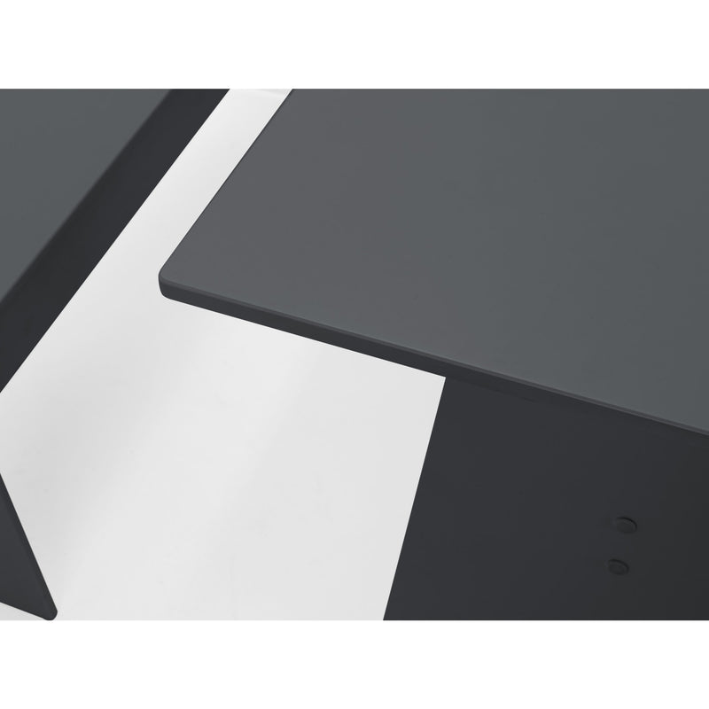 Black office desk with a white wall background