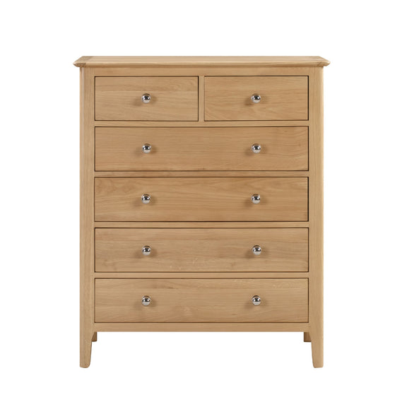 Wooden dresser with six drawers on a white background
