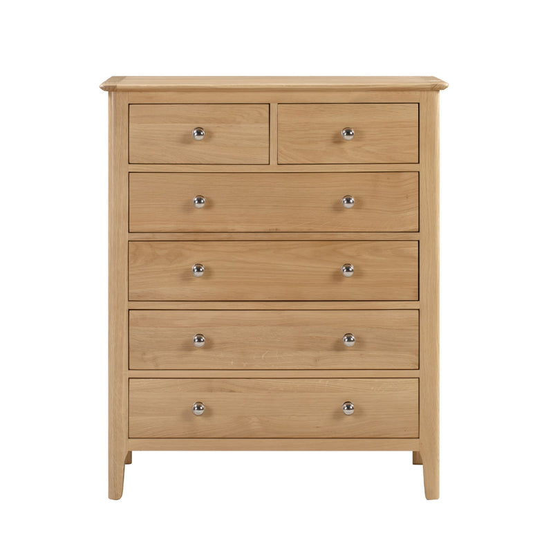 Wooden dresser with six drawers on a white background