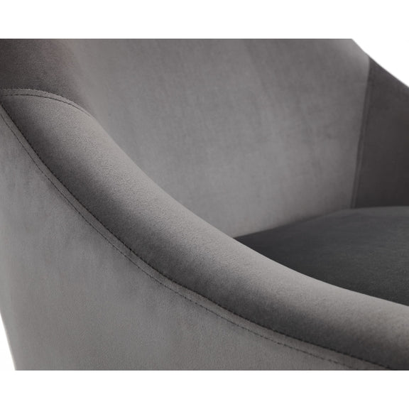 Gray upholstered chair with a focus on the armrest and seat.