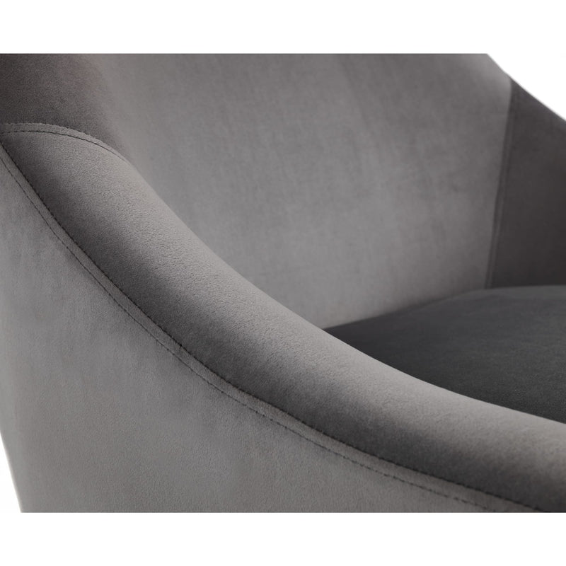 Gray upholstered chair with a focus on the armrest and seat.