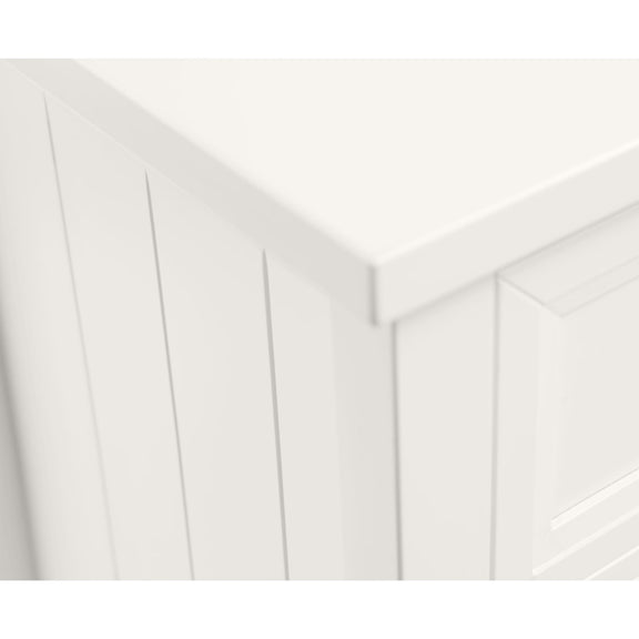 Close-up of a white wooden panel with a geometric pattern