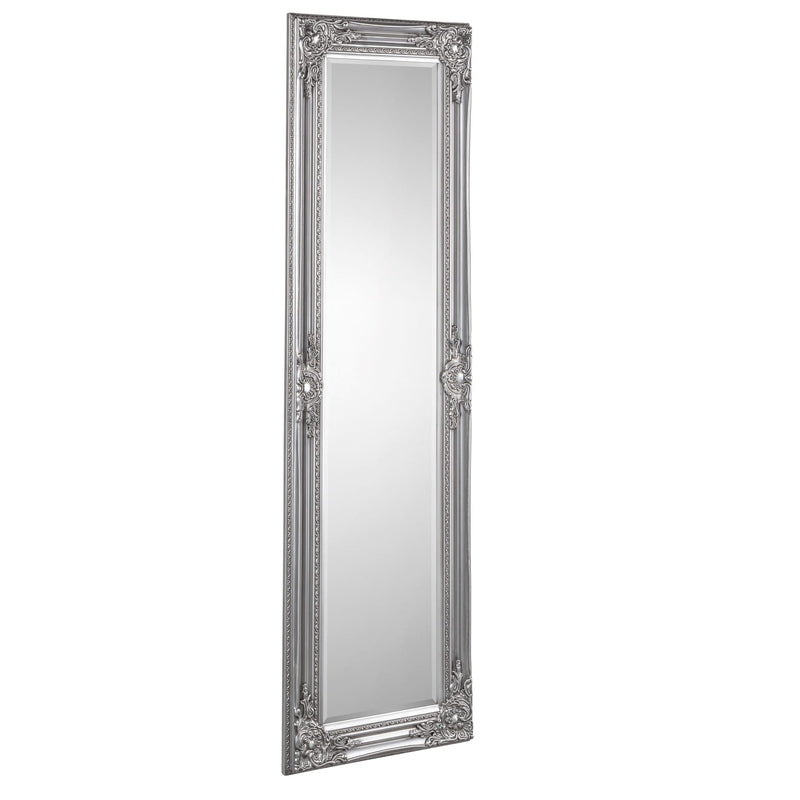 Silver ornate full-length mirror on a white background