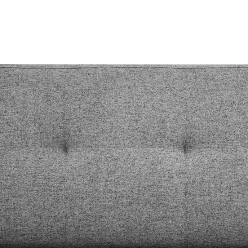 Gray upholstered headboard with tufted design on a white background
