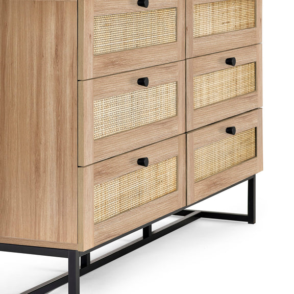 Wooden cabinet with woven drawers on a white background