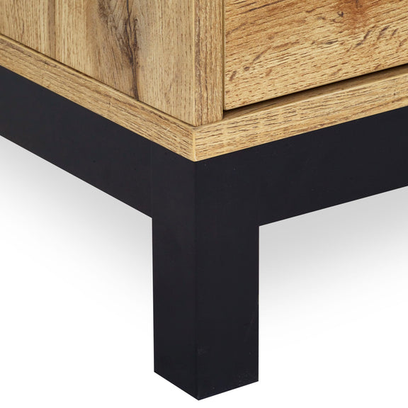 Close-up of a wooden table with black metal legs on a white background