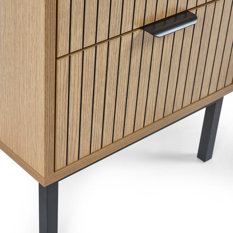 Wooden cabinet with vertical slats and black legs on a white background