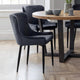 Dining room with dark gray chairs and a wooden table.