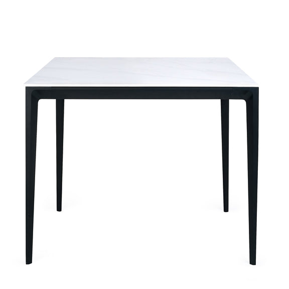 Square table with black frame and white top on a white background