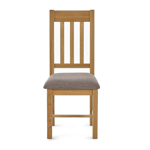 Wooden chair with a gray cushion on a white background