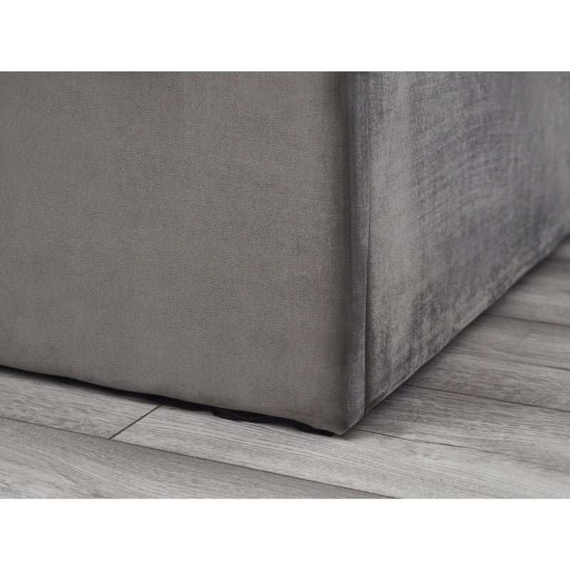 Gray textured box on a wooden floor