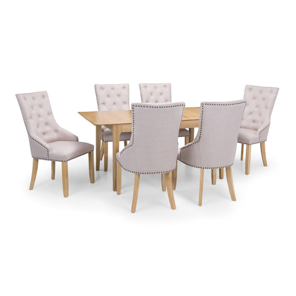 Dining table set with six upholstered chairs on a white background