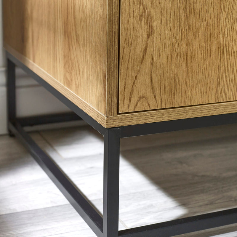 Wooden cabinet with metal legs on a wooden floor