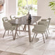 Dining room with a modern table and chairs in a bright room.