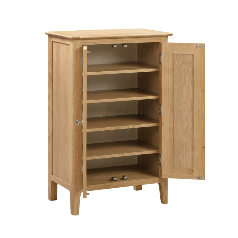 Wooden cabinet with open door on a white background