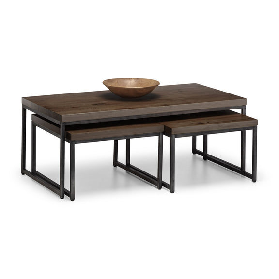 Wooden coffee table with a bowl on top against a white background