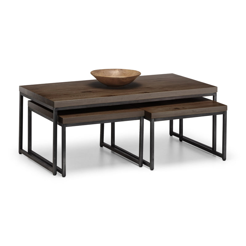 Wooden coffee table with a bowl on top against a white background