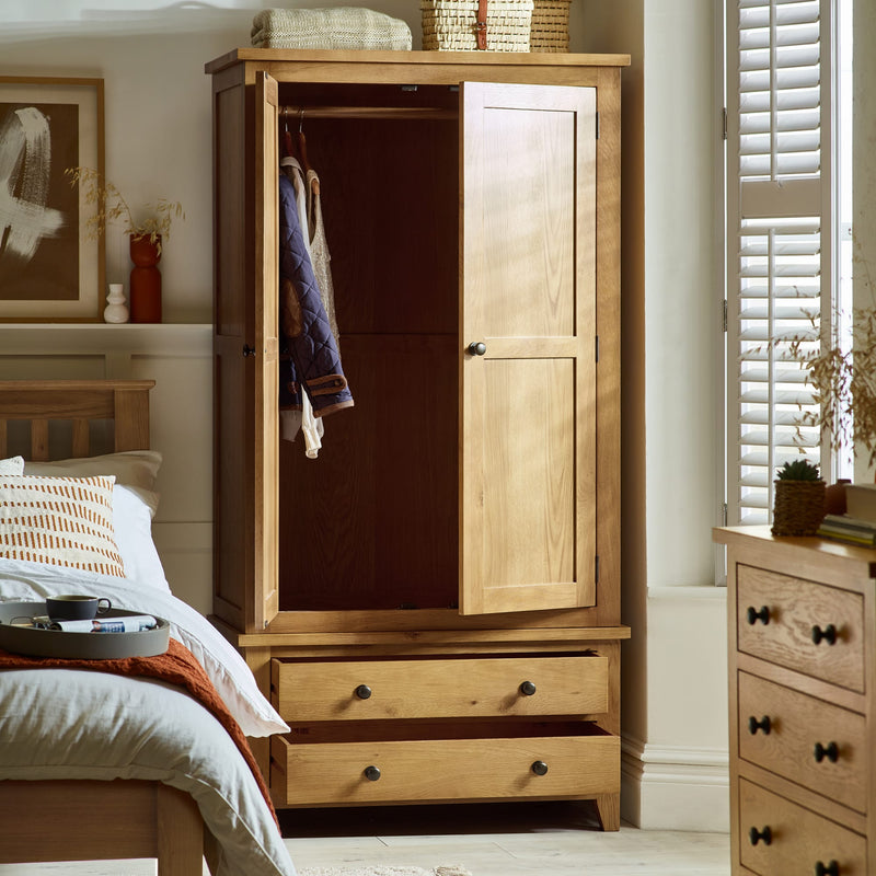 Wooden wardrobe with open door in a bedroom setting