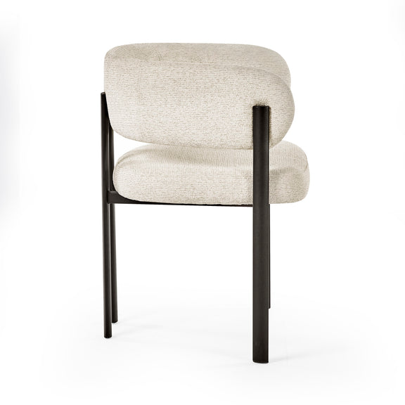 Beige upholstered chair with black metal legs on a white background