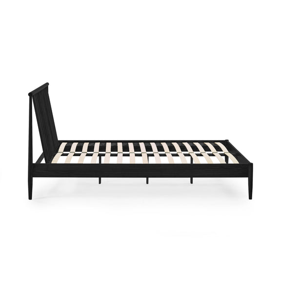 Black metal bed frame with wooden slats on a white background