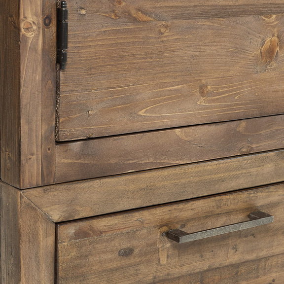 Close-up of a wooden cabinet with a metal handle