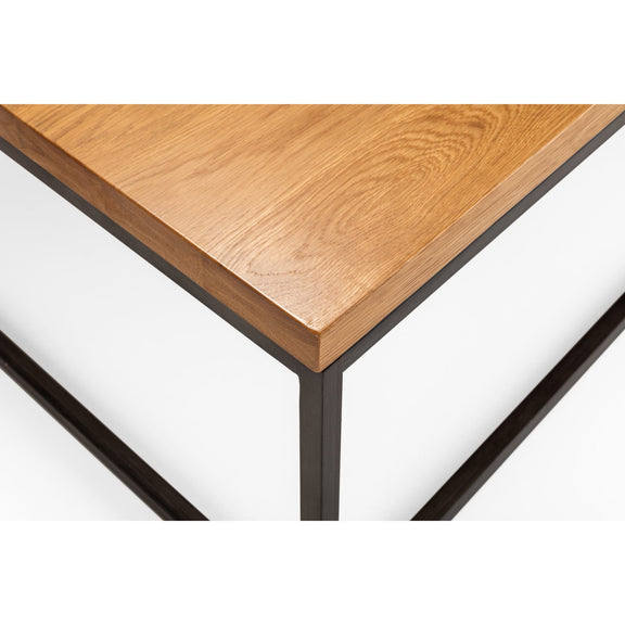 Wooden table corner with metal legs on a white background