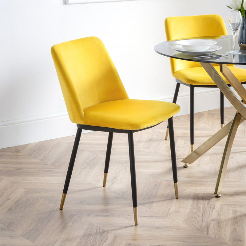 Yellow chairs with black legs in a dining setting