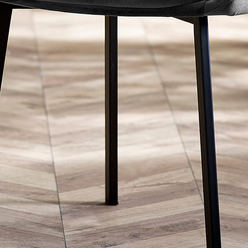 Close-up of a chair leg on a wooden floor