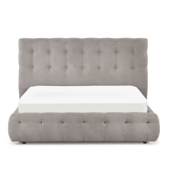 Gray upholstered bed with a white mattress on a white background