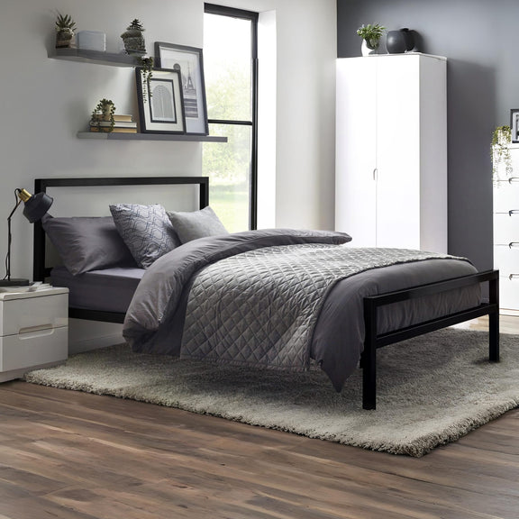 Modern bedroom with a black bed frame, gray bedding, and white wardrobe.