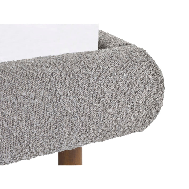 Close-up of a textured gray surface with a white edge on a white background