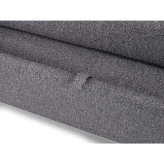 Close-up of gray fabric with a visible brand logo on a white background