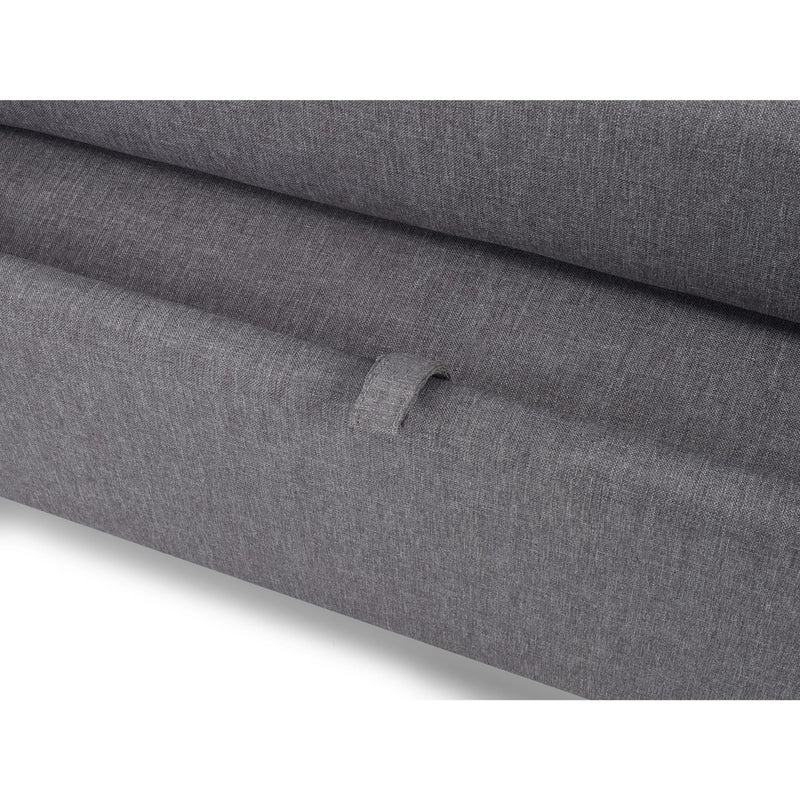 Close-up of gray fabric with a visible brand logo on a white background