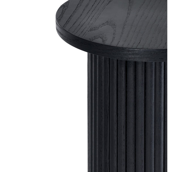 Black cylindrical side table with a round top on a white background
