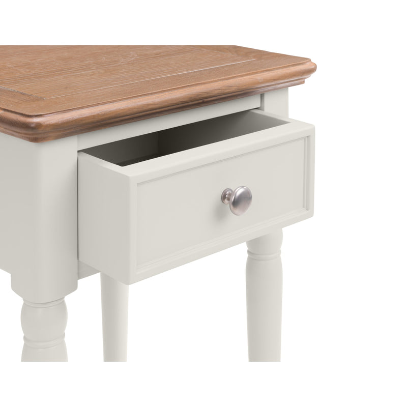 White side table with a wooden top and drawer on a white background