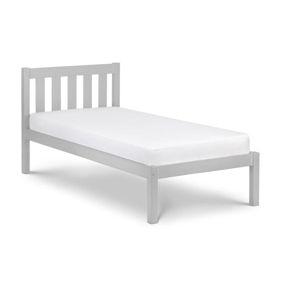 White bed frame with mattress on a white background