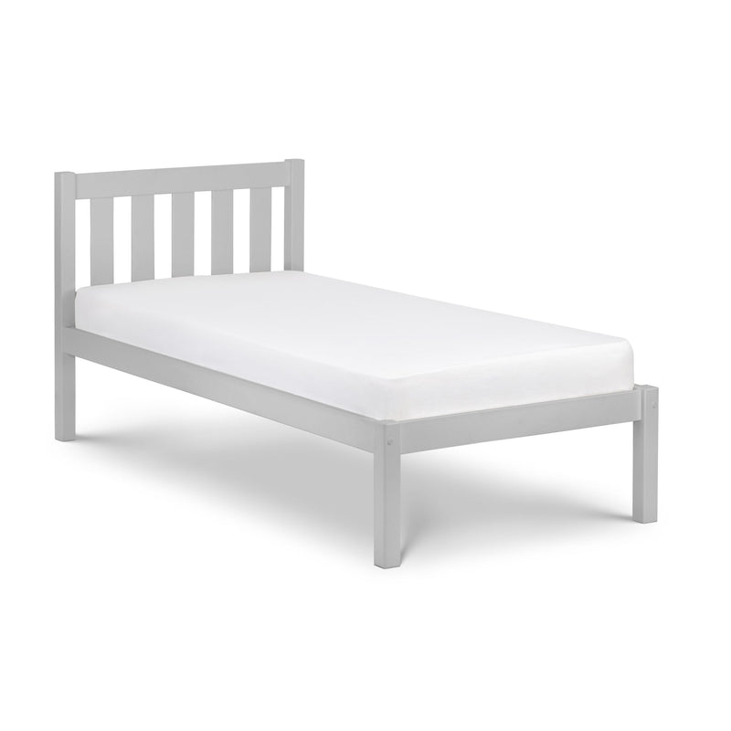 White bed frame with mattress on a white background